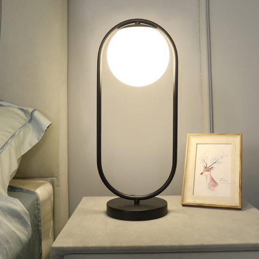 Lampe de chevet boule en verre et métal doré