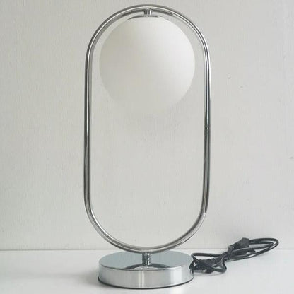 Lampe de chevet boule en verre et métal doré